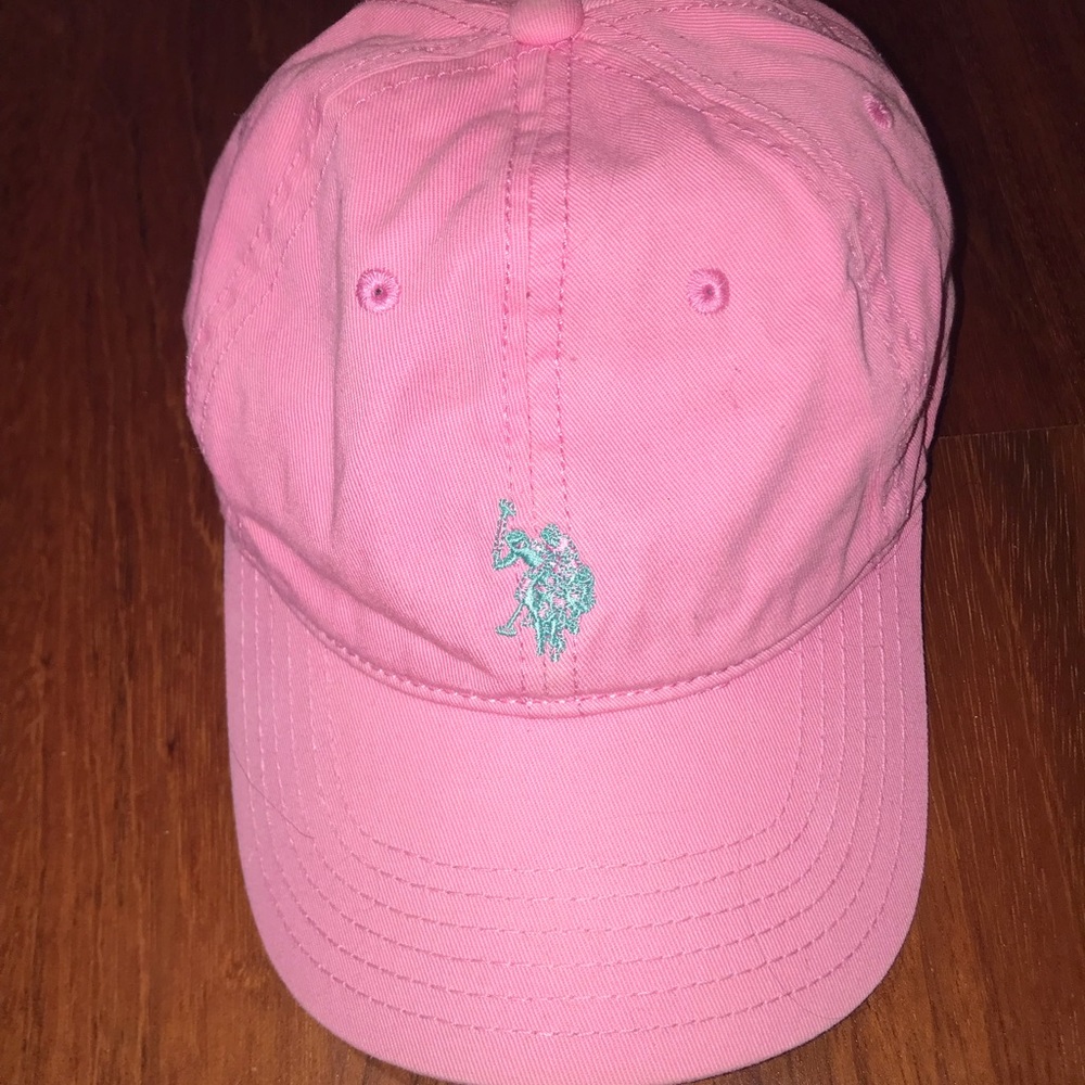 pink with blue logo polo hat, slightly worn